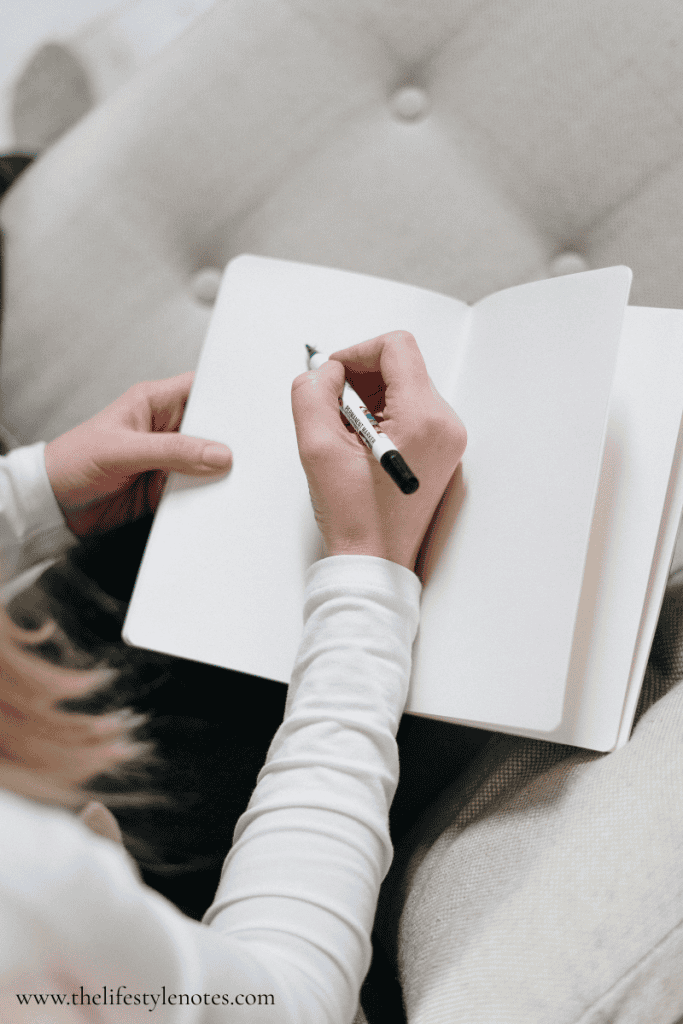 How To Simplify Meal Planning. Woman writing in blank notebook.