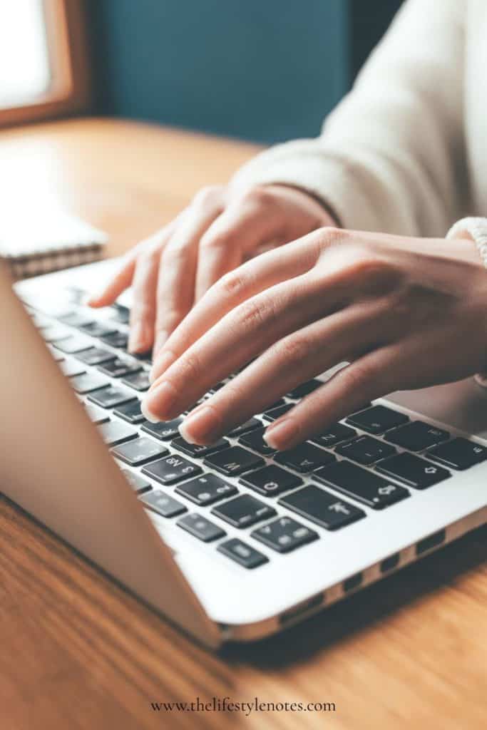 AI Hacks for Busy Moms. A woman's hands typing on the keyboard of a laptop computer.