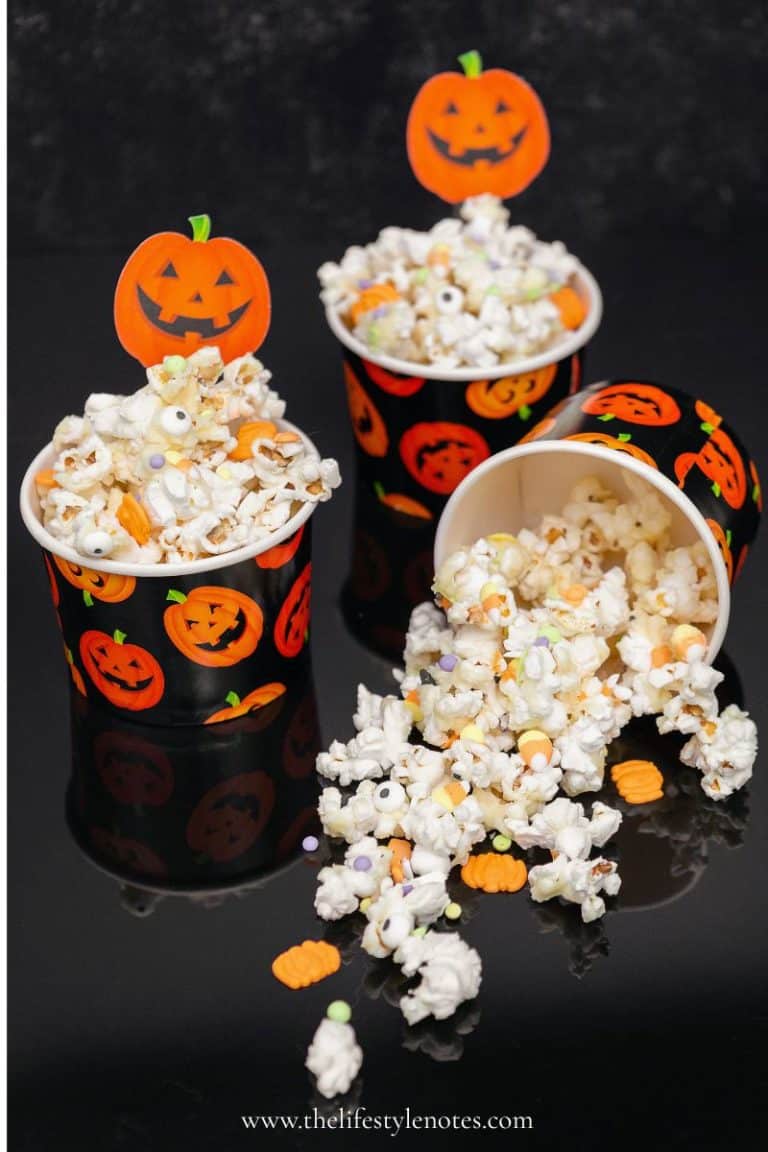 Halloween Movie Night Ideas. Small pumpkin cups filled with a Halloween popcorn mix.
